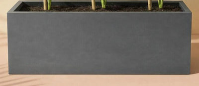 Rectangle Pots for Plants. Rectangular gray planter with plants on a wooden surface. 